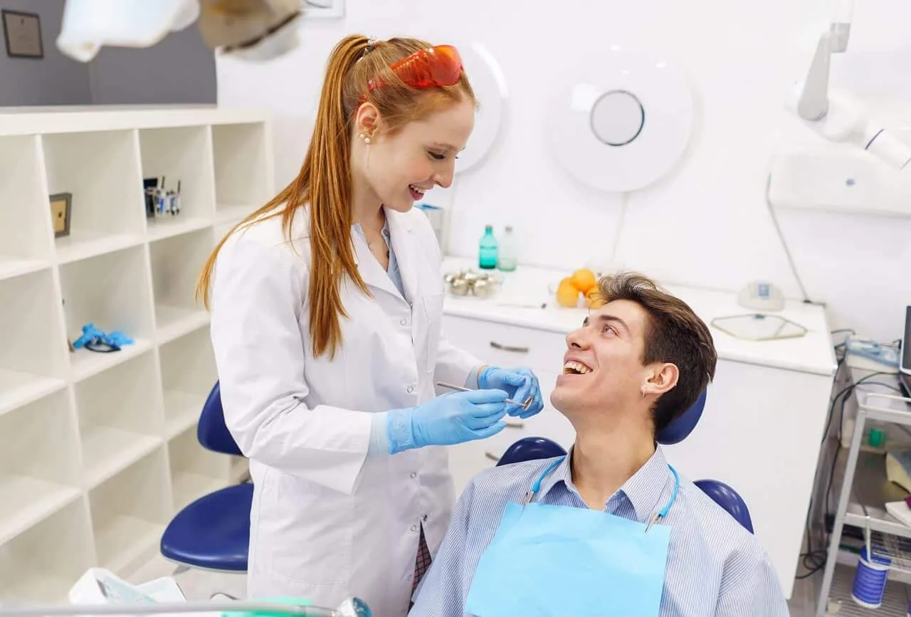 A friendly dentist and patient at Premier Dental Implant Centers